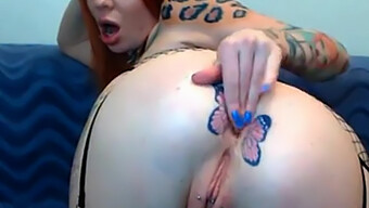 Tattooed Redhead Flaunts Her Butterfly Tattoos In Webcam Video